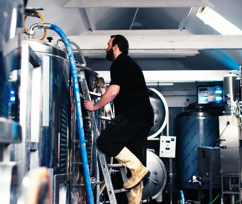 Ferry Ales Brewery - Climbing ladder against fermentor